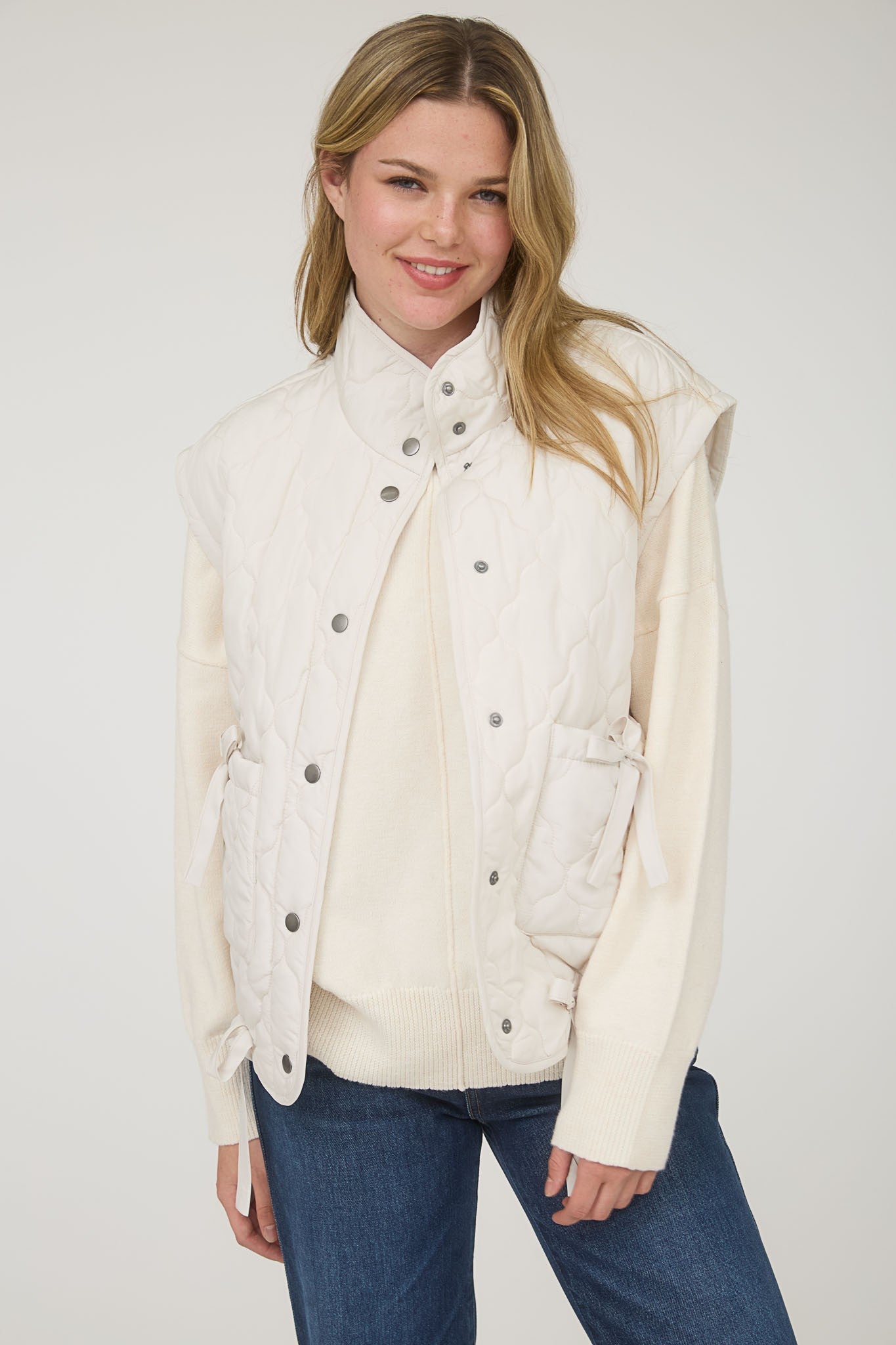 IVORY BOW PUFFER VEST