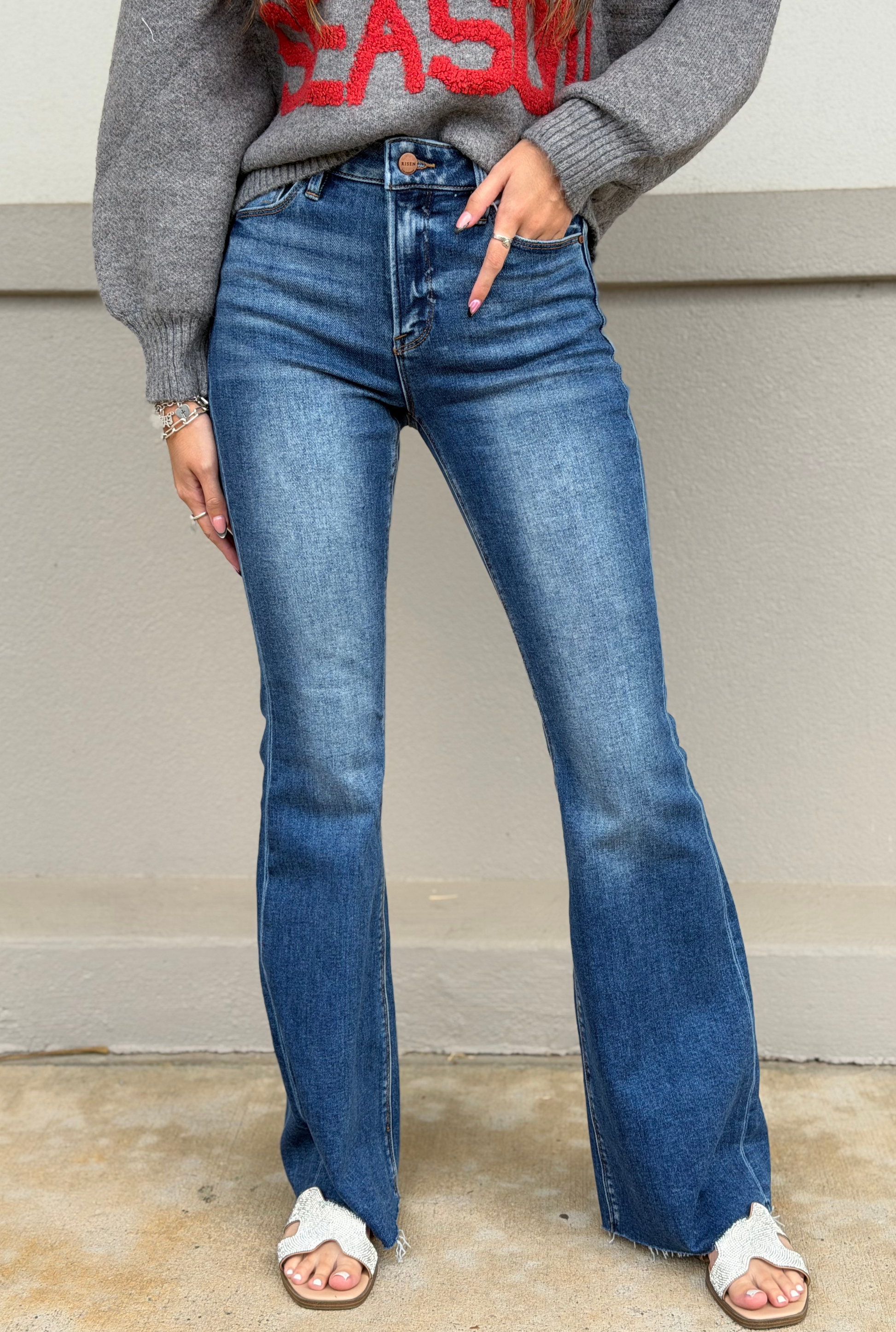 HIGH RISE FLARE JEANS WITH RAW CUT HEM JEANS