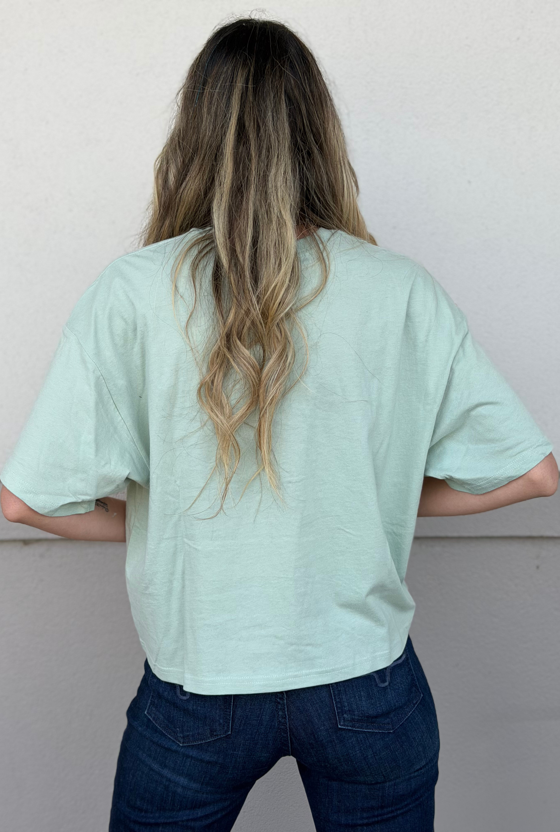 THE RODEO GOES ON FOREVER GRAPHIC RELAXED CROP TOP