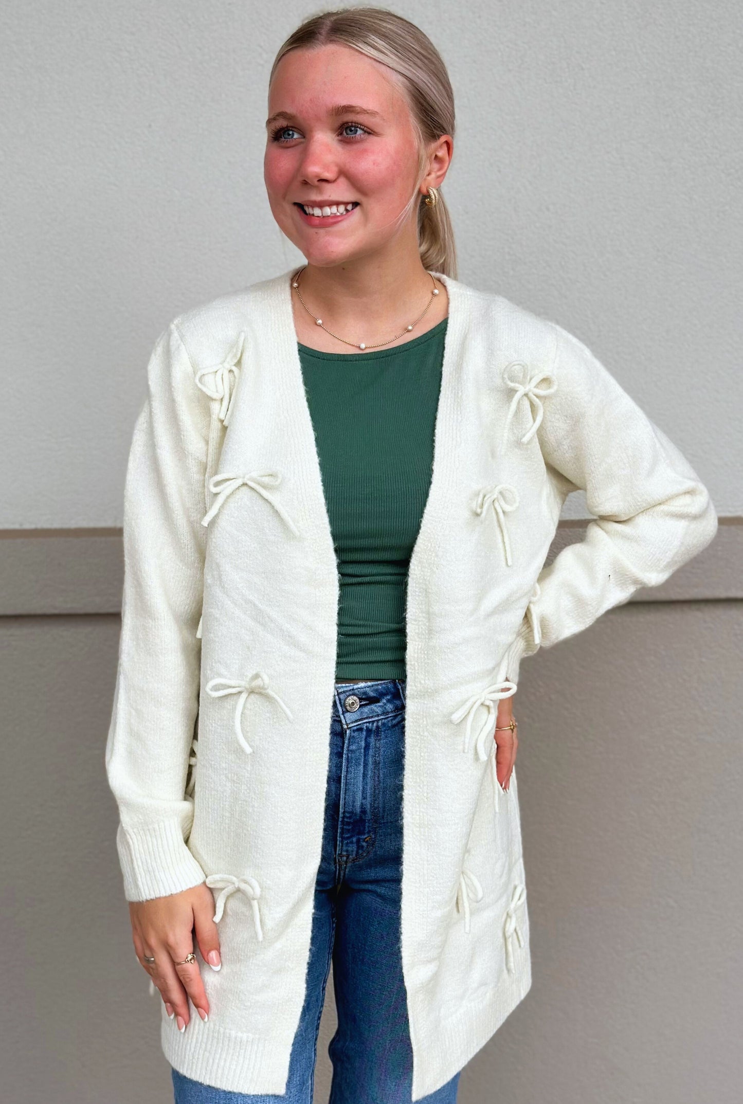 IVORY BOW CARDIGAN