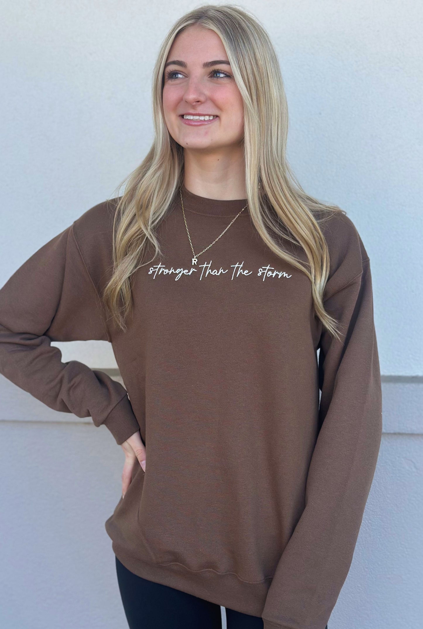 BROWN STRONGER THAN THE STORM SWEATSHIRT